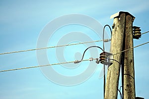 Old electricity pole exposed with sky background