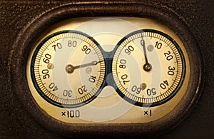 Old electromechanical counter - two dials and needles reading zeros photo