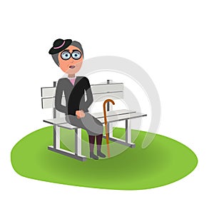 Old elegant lady with hat and stick sitting on bench