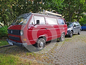 Old but elegant renovated classic oldtimer bus VW Transporter T3 parked