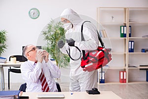 Old employee catching coronavirus at workplace