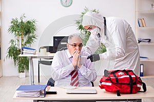 Old employee catching coronavirus at workplace