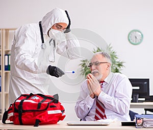 Old employee catching coronavirus at workplace