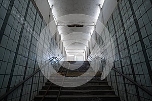 Old empty abandoned dirty underpass way up stairs