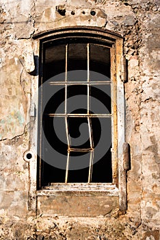 Old empty barred window in the house