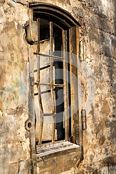 Old empty barred window in the house