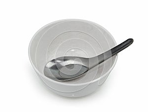 Old empty bowl with spoon