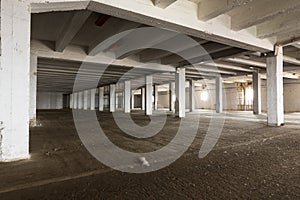 Old empty industrial warehouse interior, bright light