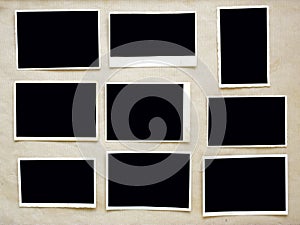 Old empty photo frames, grungy photo prints on grungy background with free pix space