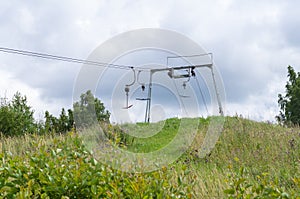 Old empty ski lift in summer landscape