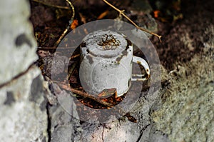 Old enameled cup in a forgotten place