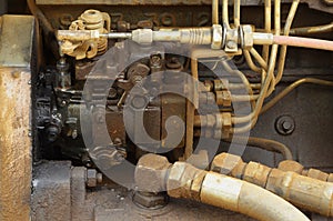 Old engine of grader car with oil engine leak