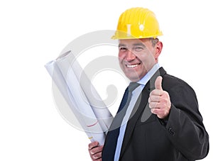 Old engineer holds drafts and thumbs up