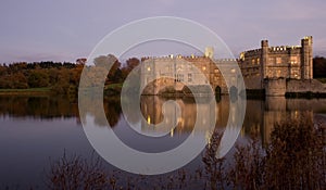 Old English Castle and lake at sunset