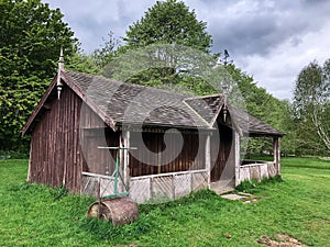 An old English cricket pavilion with roller