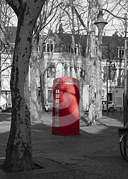 Old English red phone booth on a square