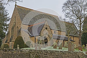 Old English rural village church with graveyard cemetary