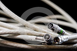 Old entangled cables, electronics and old cable connectors on a
