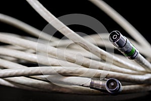 Old entangled cables, electronics and old cable connectors on a