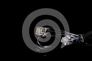 Old entangled cables, electronics and old cable connectors on a