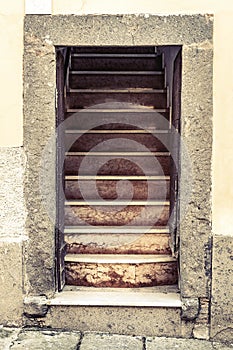 Old entrance stone house open door with stairs