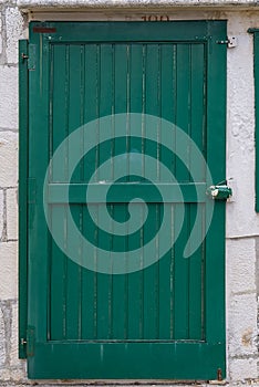 Old entrance wooden green door. Antique wooden green door