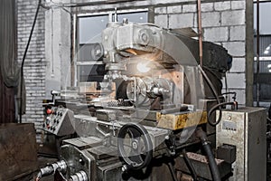 Old equipment milling machine for metal processing in the workshop of an industrial enterprise