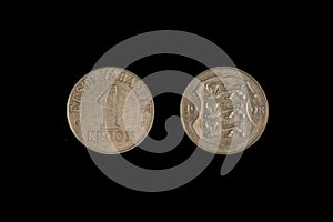 An old Estonian coin isolated on black, 1 one kroon 1998 year. Coinage, close-up