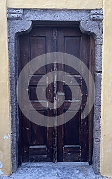 Old European Home Entrance with Brown Wooden Door