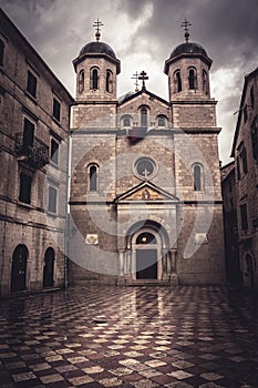 Old European St. Nicholas Orthodox Church in front of dramatic sky in old European city Kotor in Montenegro Montenegro, Kotor, T