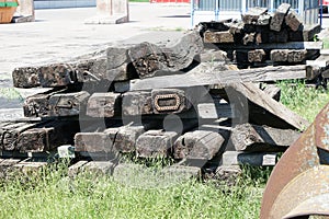 Old exchanged wooden railway sleepers stored for further use