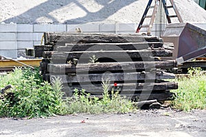 Old exchanged wooden railway sleepers stored for further use