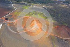 Old extinct inactive craters on the slope of the volcano Etna with tourist trails, aerial top view