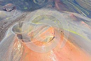 Old extinct inactive craters on the slope of the volcano Etna with tourist trails, aerial top view