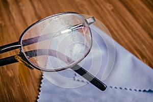 Old Eyeglass with many scratches