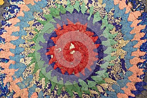 Old fabric textile circle with colored rag texture