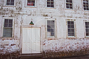 Old facade with lamp, door and windows