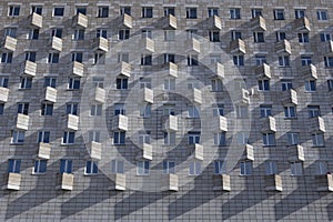 Old facade of a soviet ussr concrete constructivism brutalism building with rectangular windows and balconies. filled frame photo