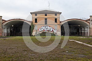 an old factory abandoned graffiti on the wall