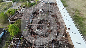 Old factory building ruins with greenery in the background