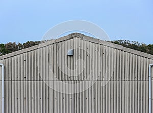 old factory metal plate wall facade gable roof.