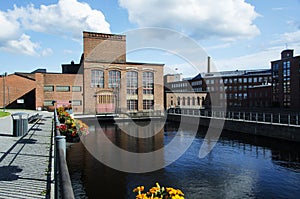 Old factory's buildings region by the river