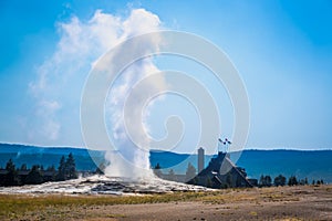 Old Faithful Geyser Erupting at Yellowstone National Park. photo