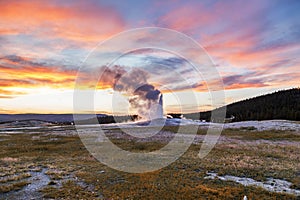 Old and faithful Geyser erupting at Yellowstone National Park photo