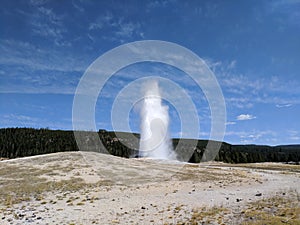 Old Faithful Geyser eruption at Yellowstone National Park