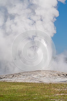Old Faithful Geyser erupts in the morning at Yellowstone National Park