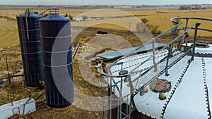 Old farm grain silos in field