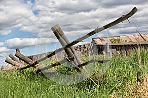 Old farm with the house and field grassed