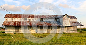 Old Farm House With Rustic Rusty Roof In The Mississippi Delta