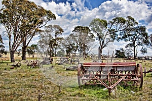 Old farm machinery in field